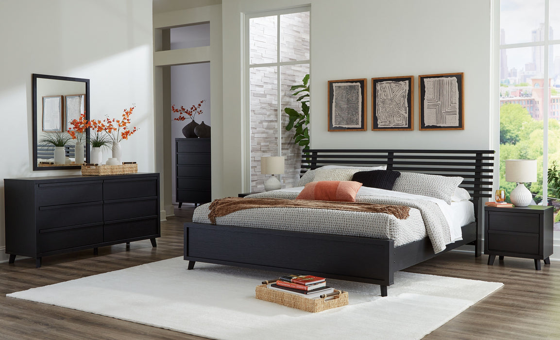 Danziar - 8 Pc. - Dresser, Mirror, King Slat Panel Bed, 2 Nightstands - Black