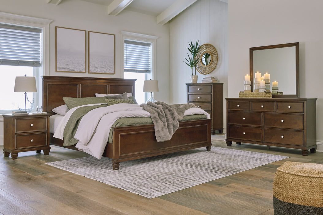 Danabrin - 7 Pc. - Dresser, Mirror, King Panel Bed, 2 Nightstands - Brown