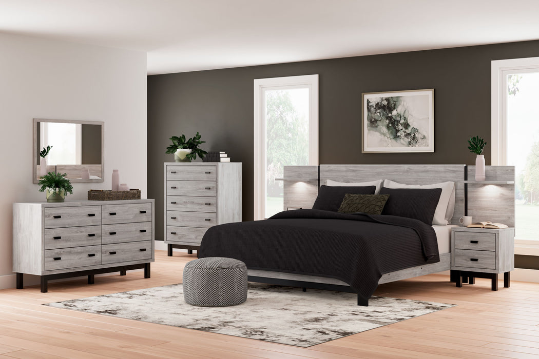 Vessalli - 9 Pc. - Dresser, Mirror, Chest, King Panel Bed With Extensions, 2 Nightstands - Gray