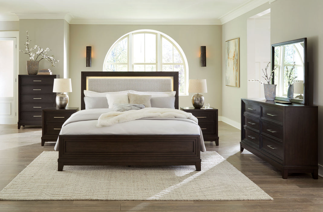 Neymorton - 7 Pc. - Dresser, Mirror, California King Upholstered Panel Bed, 2 Nightstands - Dark Grayish Brown