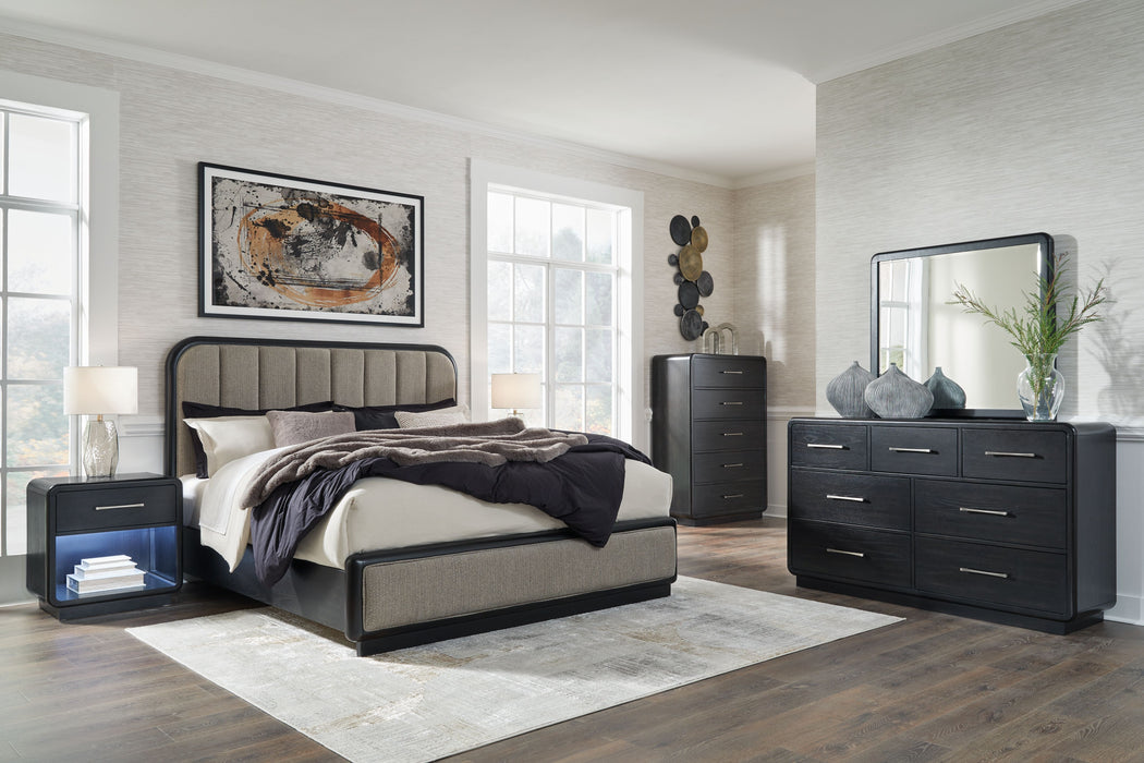 Rowanbeck - 7 Pc. - Dresser, Mirror, Chest, California King Upholstered Panel Bed, 2 Nightstands - Gray / Black